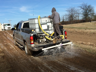 Spray truck applys TerraZyme solution