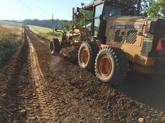 Cover the windrowed soil to let the road treatment rest