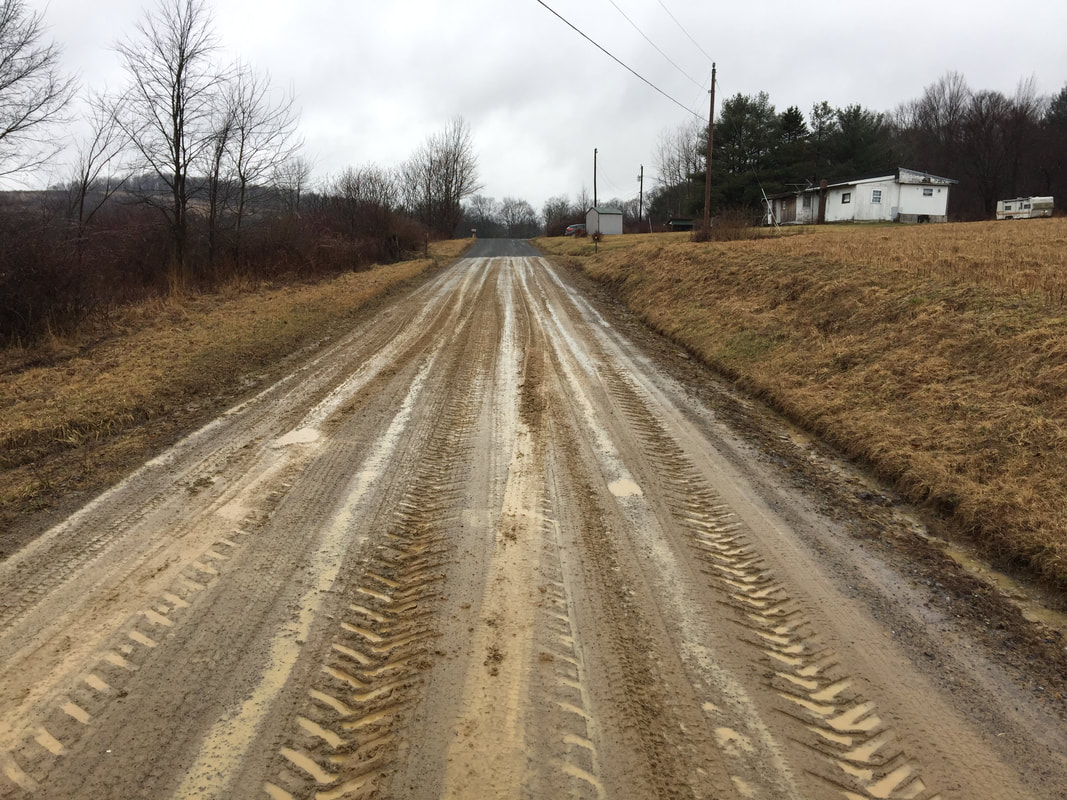 Muddy road before TerraZyme application