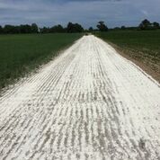 A layer of ROAD-HARD applied by drop spreader.