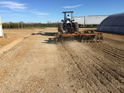 Tractor tilling soil